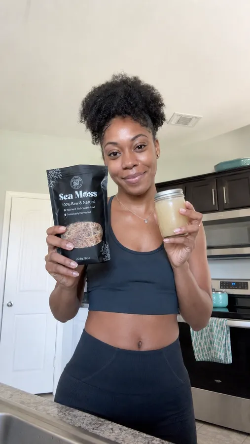 Customer holding Fresh Sea Moss and a jar of prepared gel